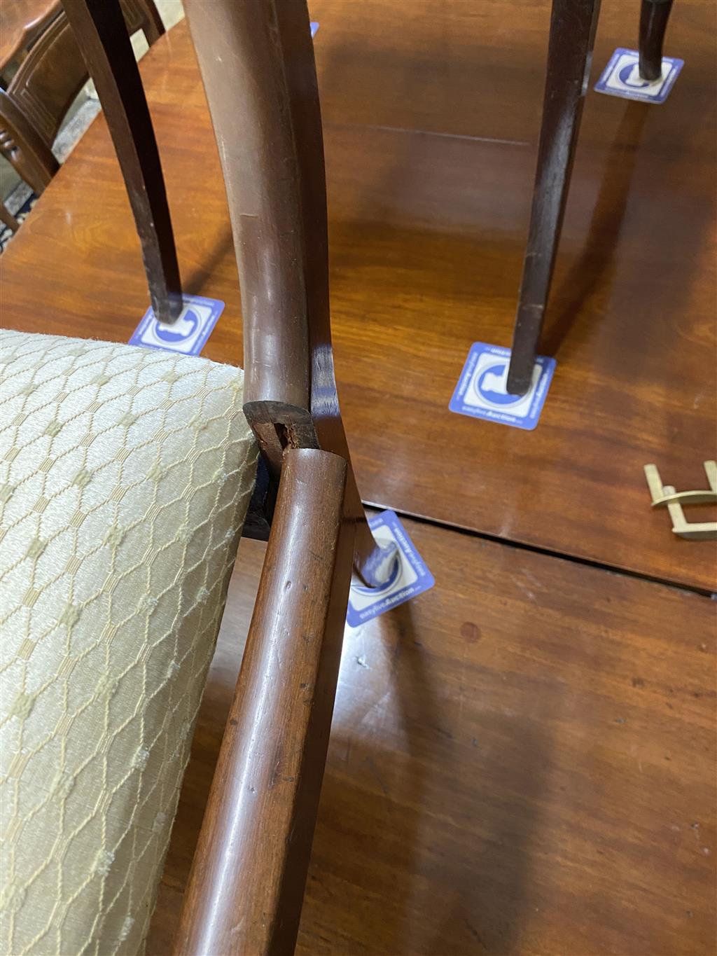 A set of eight Regency mahogany brass inlaid dining chairs, on sabre legs and a similar elbow chair